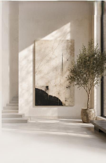 Sunlit interior with a large abstract painting and an olive tree beside a staircase